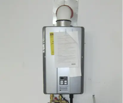 a compact design rv tankless water heater installed in RV