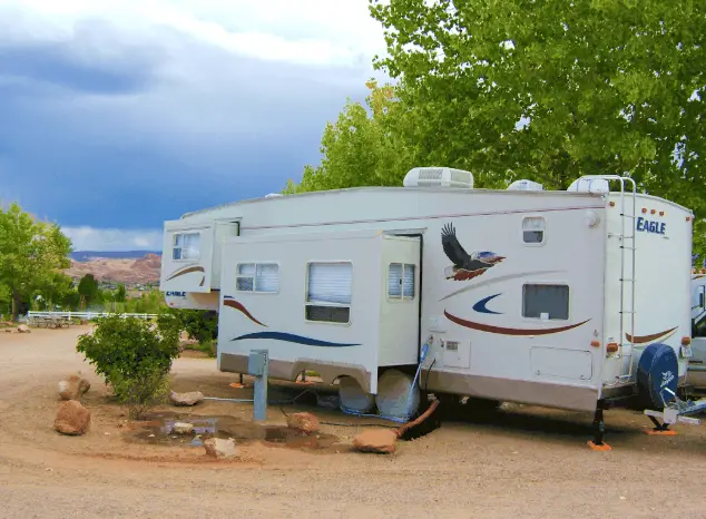 a fifth wheel rv connected to hookup