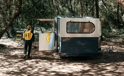 a man and trailer at a boondocking site