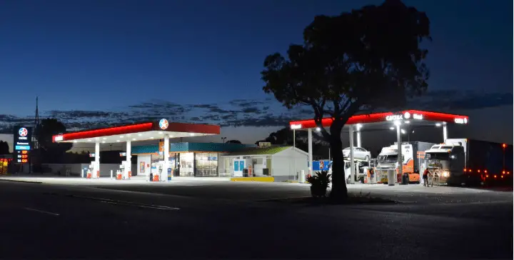 trucks parked at night at a truck stop