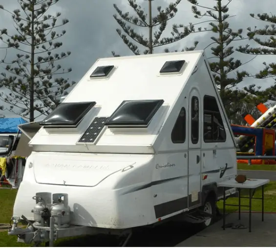 aframe camper parked inside a campground