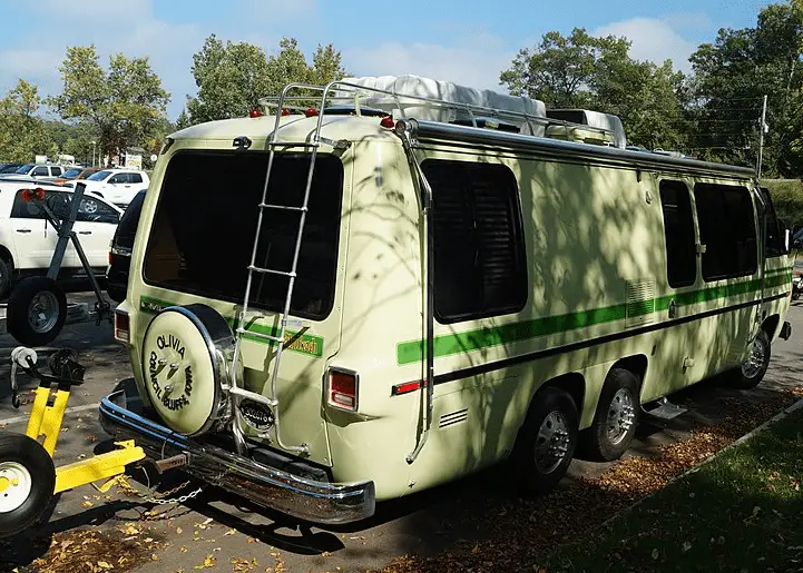 rv with roof rack and ladder